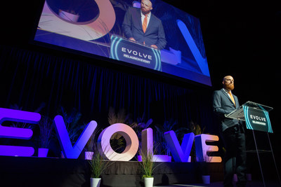Evolve President & Executive Director Casey Brown announces eMobility Microgrant funding opportunity on stage at the Evolve Relaunch Event.