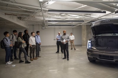 Doron Elliott, Senior Manager of In-Vehicle Infotainment at Ford, giving local Georgia university students a tour of the Research and Innovation Center garage where engineers will be developing new features for Ford vehicles.