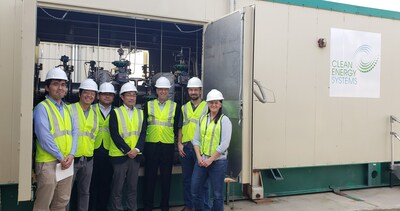 Takeo Nukui, Executive Officer of Metal One, and Keith Pronske, President & CEO of CES, with colleagues in front of CES’ 200 MWt oxy-combustor