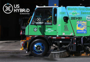 A zero-emission street sweeper manufactured by Global Environmental Products, featuring technology from US Hybrid.